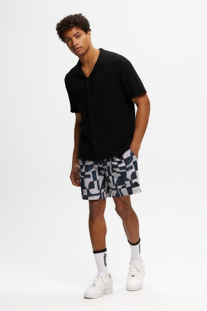 Kuwalla Tee - Knitted Yacht Shirt in Black